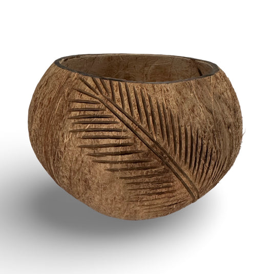 Hand-carved coconut shell bowl with palm leaf pattern