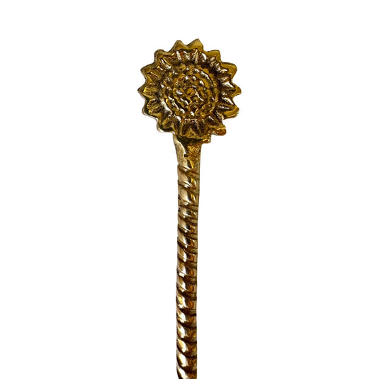 Brass ritual tea spoon with rising sun handle detail