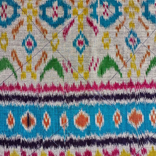 Handwoven endek table napkins set in teal lagoon ikat pattern detail