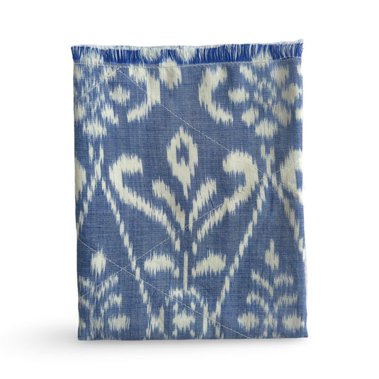 Handwoven endek tea towel in soft indigo with traditional pattern