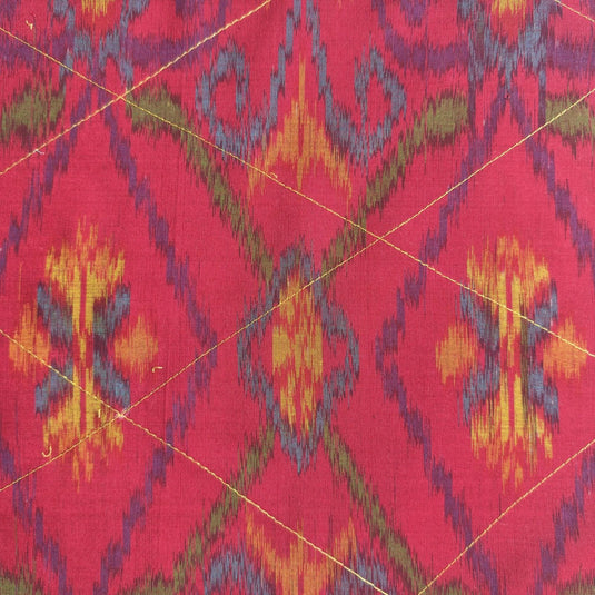 Handwoven endek tea towel in sunset fuchsia ikat pattern detail