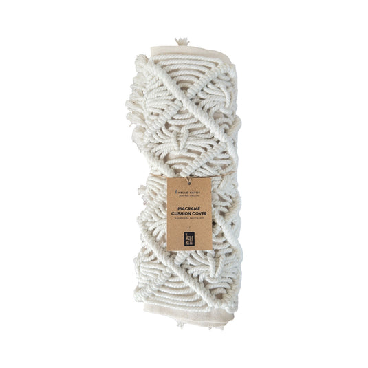 Folded macramé cushion cover with Hello Ketut product tag