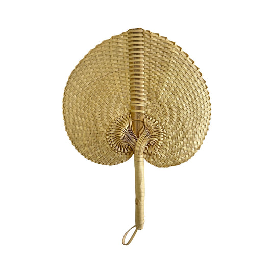 Handwoven Balinese palm fan with natural woven pattern