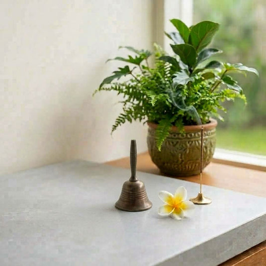 Balinese ritual brass bell with incense holder and frangipani flower