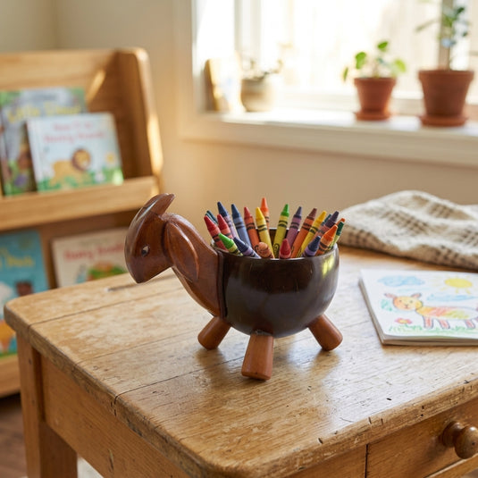 Coconut goat animal keeper filled with colorful crayons in a cozy kids’ room