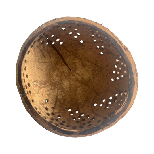 Hand-carved coconut shell lantern interior cutout pattern detail