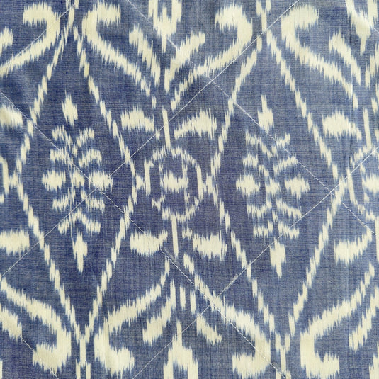 Handwoven endek tea towel in soft indigo ikat pattern detail
