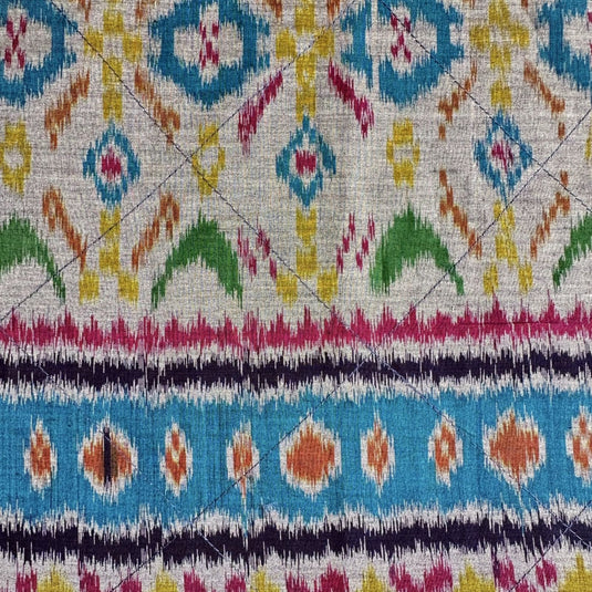 Handwoven endek tea towel in teal lagoon ikat pattern detail