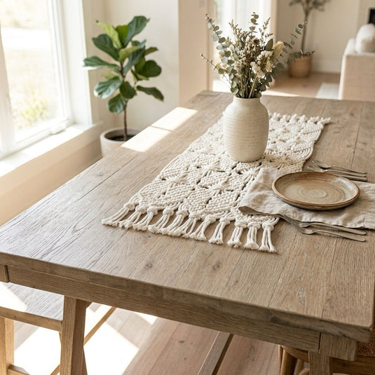 Handmade macramé table runner styled on a natural wood dining table