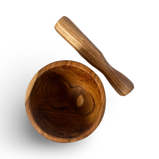 Top view of handcrafted teak mortar and pestle set